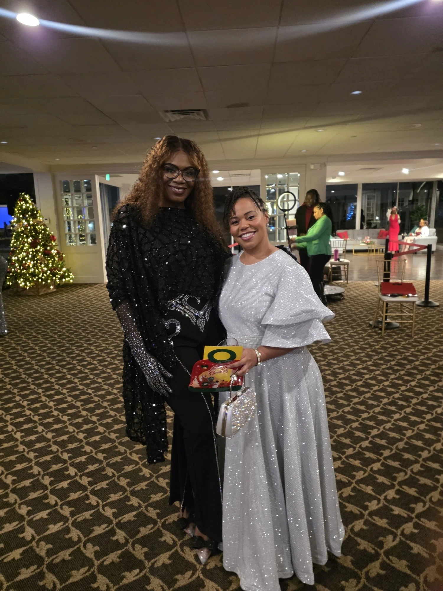 Two guests in silver sparkle and black sequin